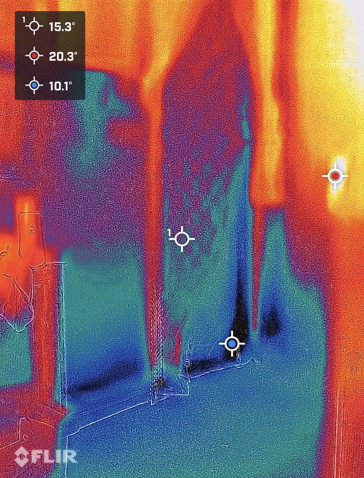 Thermal image showing cooler areas across a hallway and doorway.