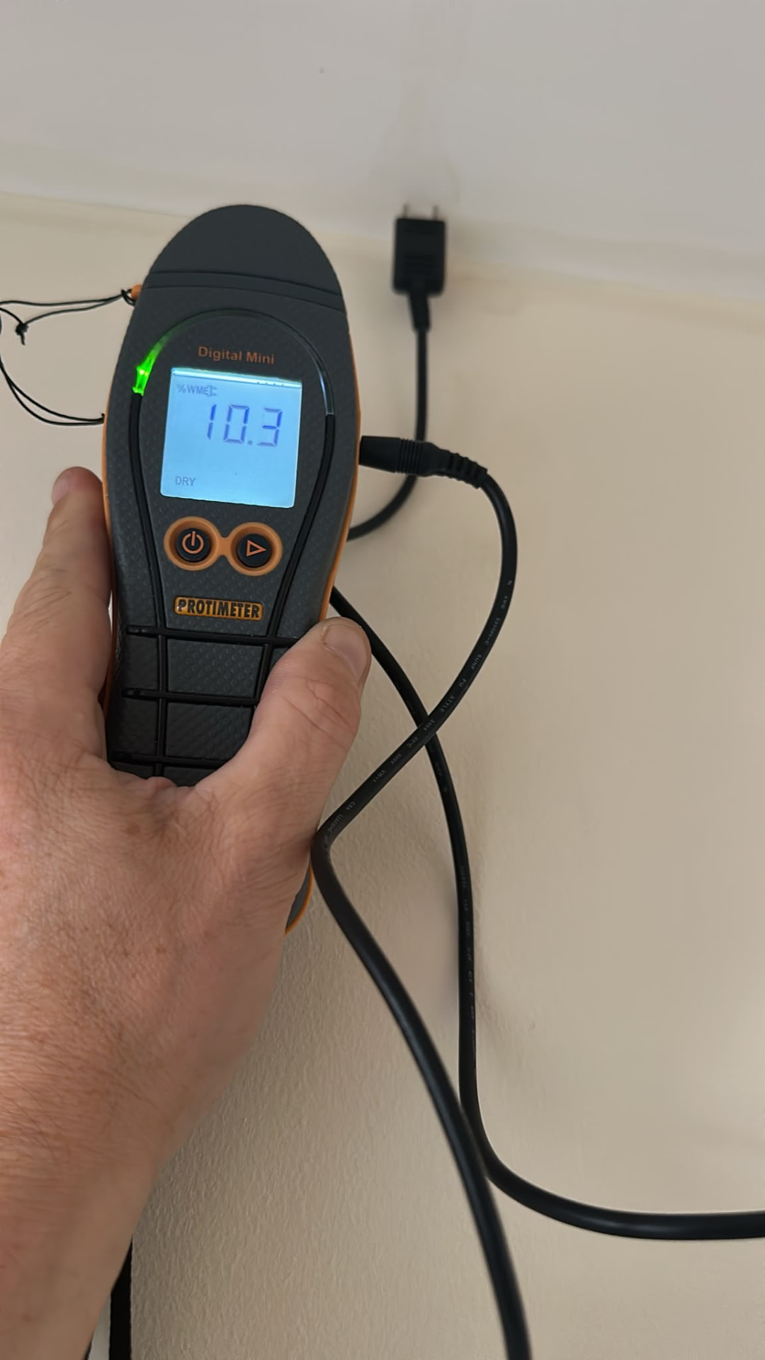 Protimeter Digital Mini reading recorded on a wall towards completion