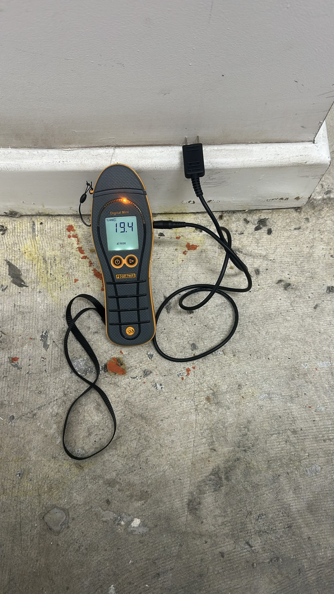 Protimeter Digital Mini reading recorded at a communal corridor floor edge