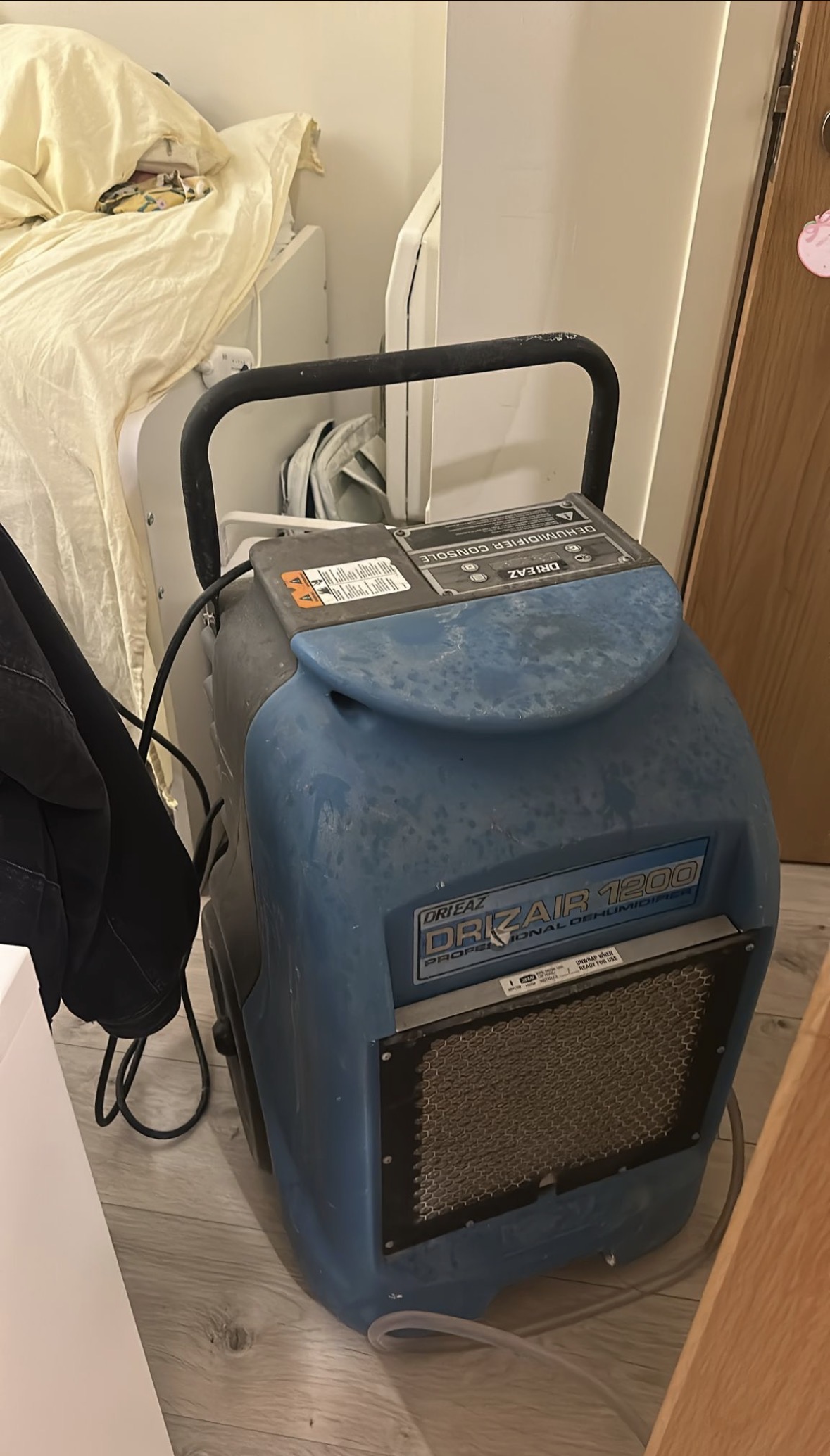 Blue professional building dehumidifier — side profile view
