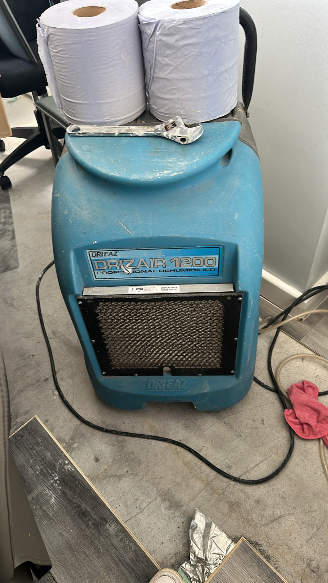 Professional Drizair 1200 dehumidifier running within the affected property