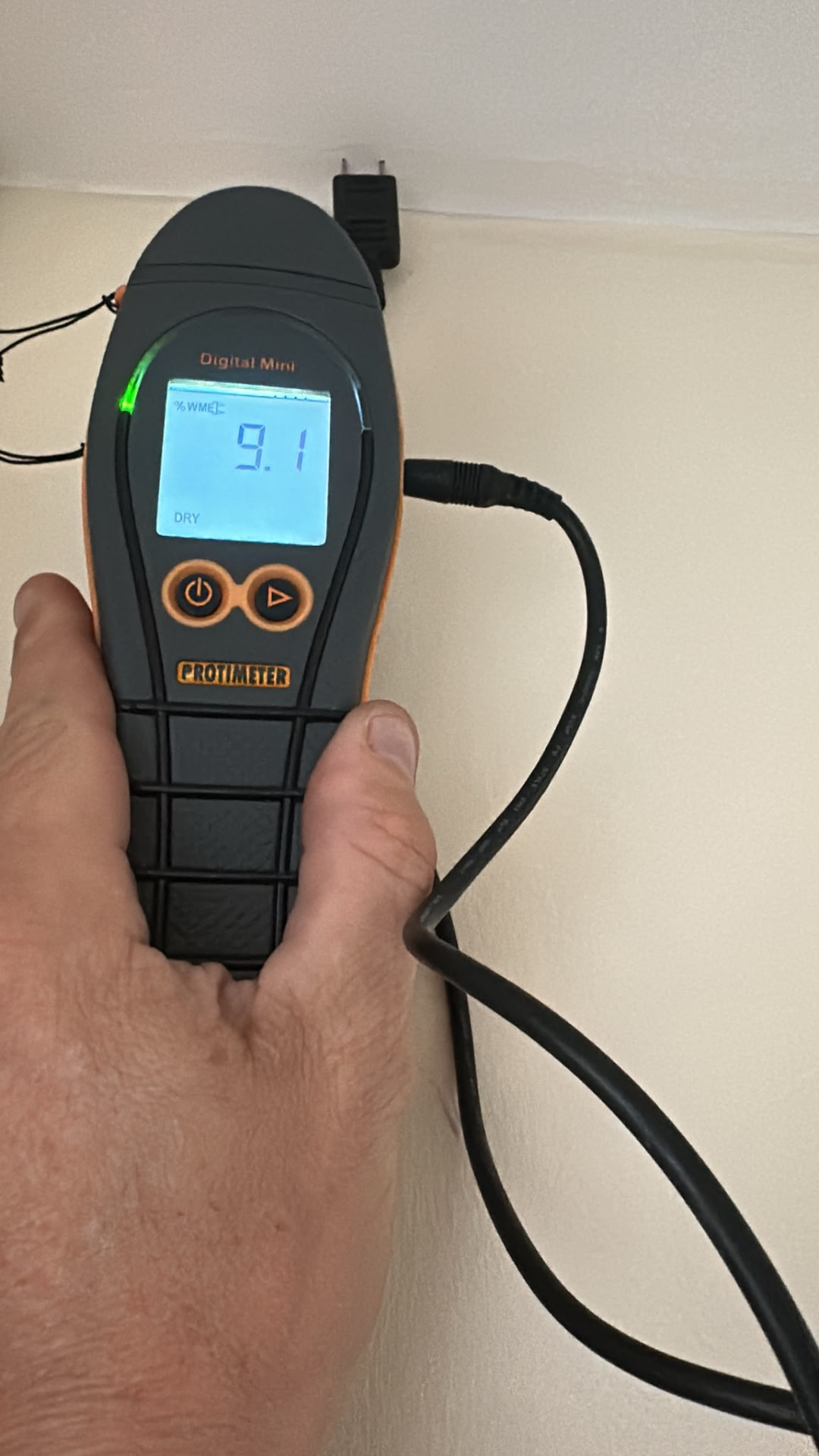 Protimeter Digital Mini reading recorded on a second-floor wall before equipment withdrawal