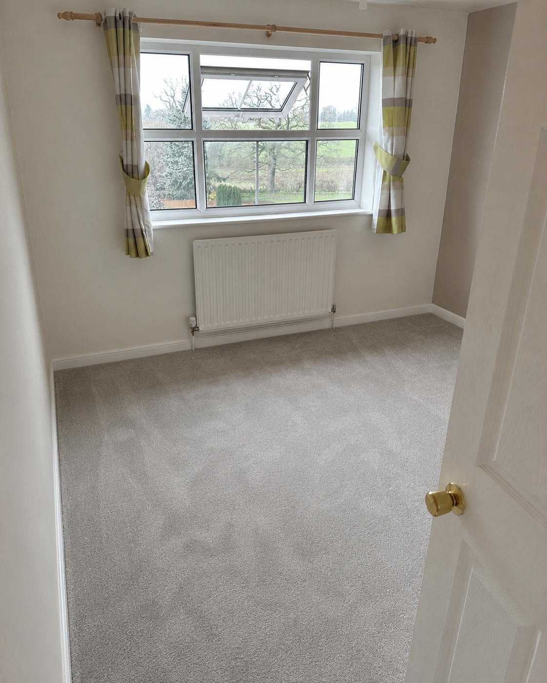 Completed bedroom with new plasterboard, decoration and flooring