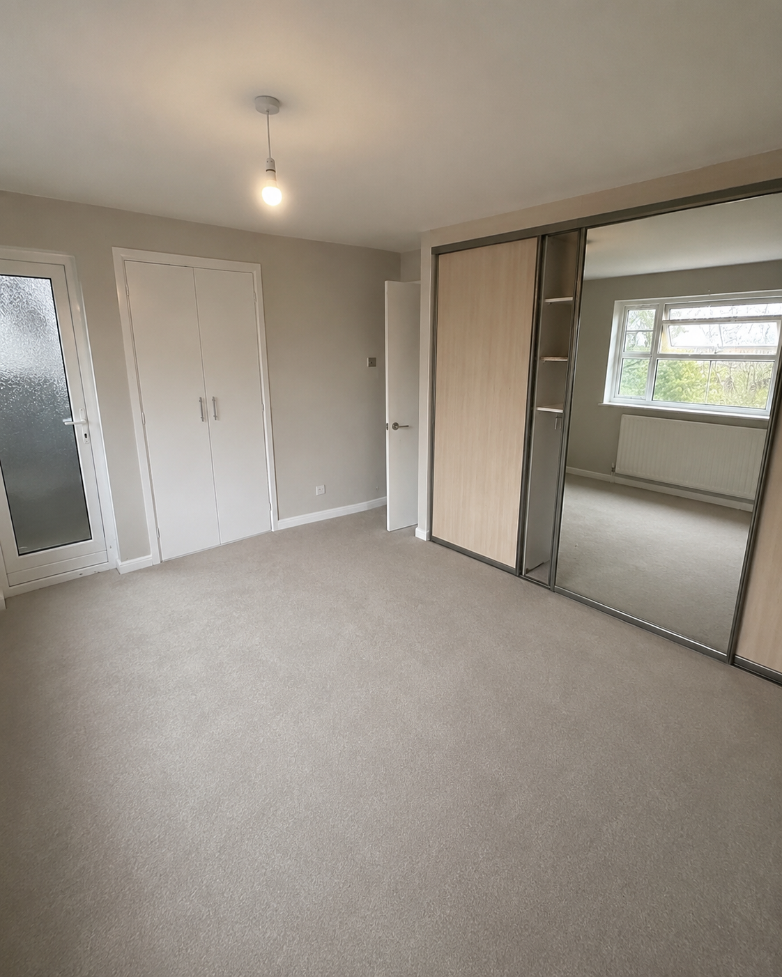 Completed main bedroom after ceiling repair and redecoration